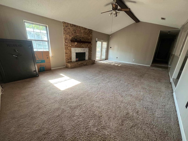 unfurnished living room featuring ceiling fan, carpet, and vaulted ceiling with beams