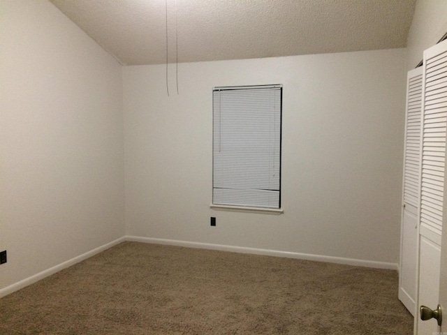 8096 Zuber Rd, Benton, AR 72019 - unfurnished bedroom featuring carpet flooring, a textured ceiling, and baseboards