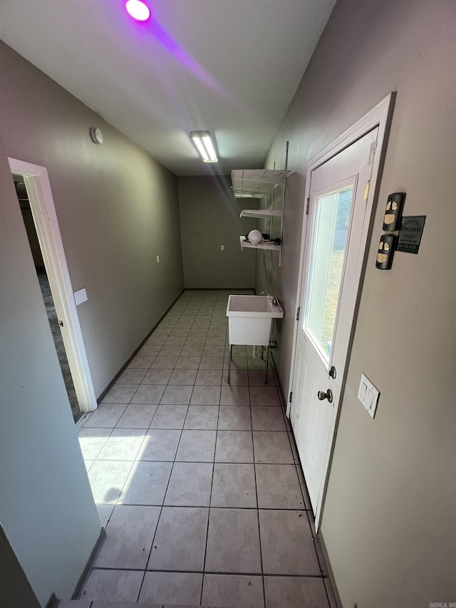 8096 Zuber Rd, Benton, AR 72019 - laundry room featuring light tile patterned flooring and a sink