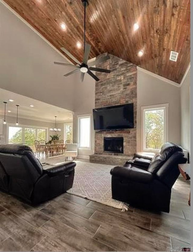 living room with a fireplace, high vaulted ceiling, and wooden ceiling