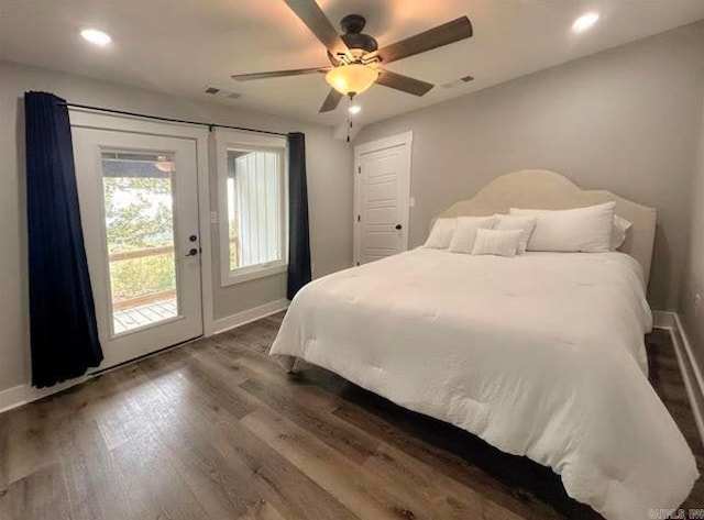 bedroom featuring french doors, dark hardwood / wood-style floors, access to outside, and ceiling fan