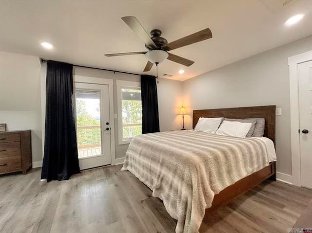 bedroom featuring light hardwood / wood-style floors, access to outside, and ceiling fan