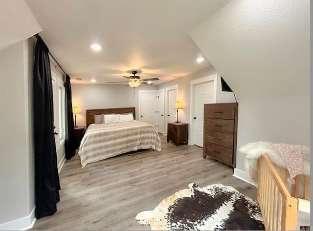 bedroom featuring light hardwood / wood-style flooring and ceiling fan