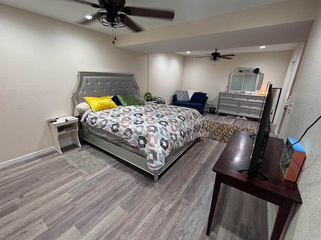 bedroom featuring ceiling fan and wood-type flooring