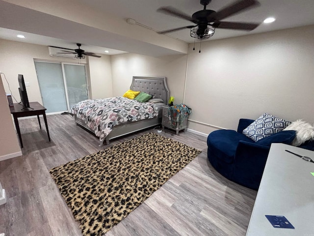 bedroom with hardwood / wood-style floors and ceiling fan