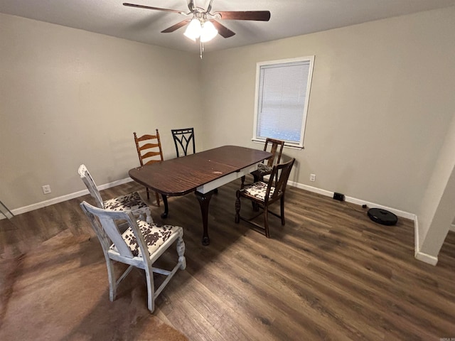 dining area with ceiling fan and dark hardwood / wood-style flooring