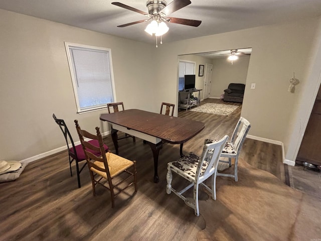 dining room with dark wood-type flooring and ceiling fan