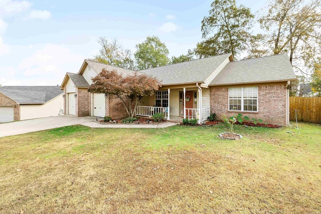 ranch-style home with a front lawn, covered porch, and a garage