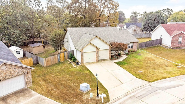 view of front facade featuring a front lawn and a garage