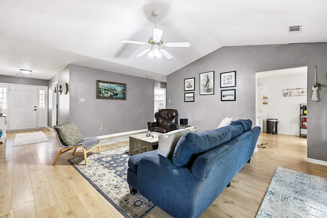 living room with a healthy amount of sunlight, vaulted ceiling, light hardwood / wood-style floors, and ceiling fan