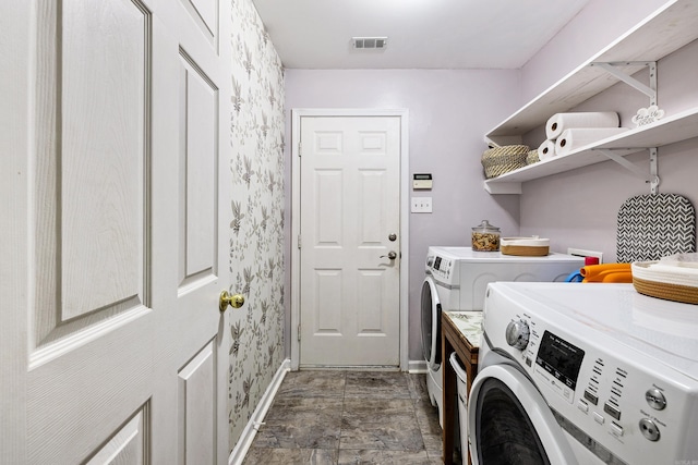 clothes washing area featuring washing machine and dryer