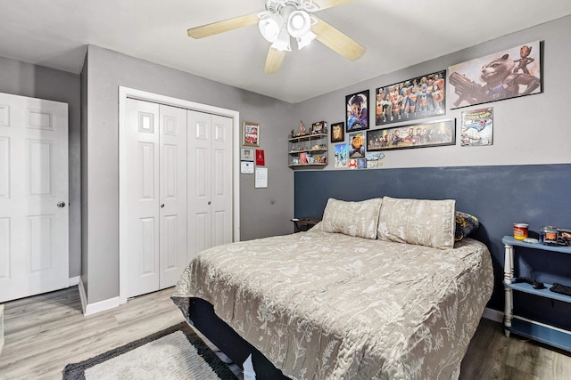 bedroom featuring hardwood / wood-style flooring, a closet, and ceiling fan