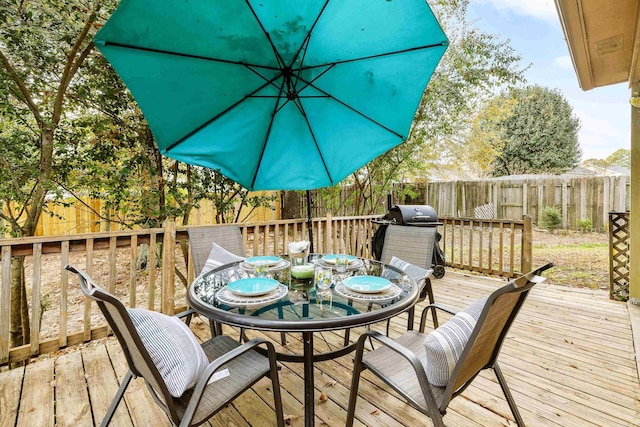 wooden deck with grilling area