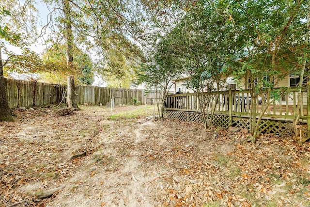 view of yard featuring a wooden deck