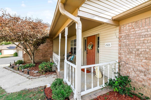 doorway to property featuring a porch