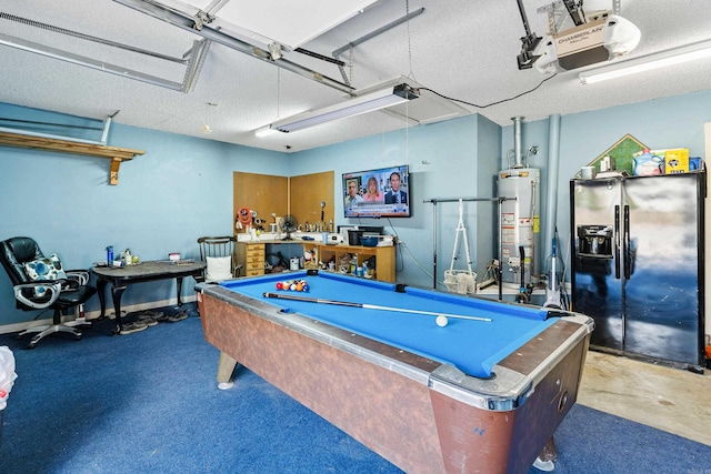 recreation room featuring pool table, water heater, and a textured ceiling