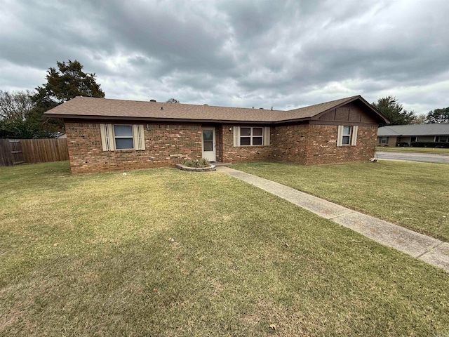 ranch-style home featuring a front yard