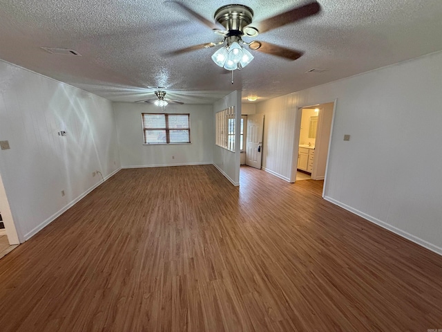 spare room with ceiling fan, wood-type flooring, and a textured ceiling