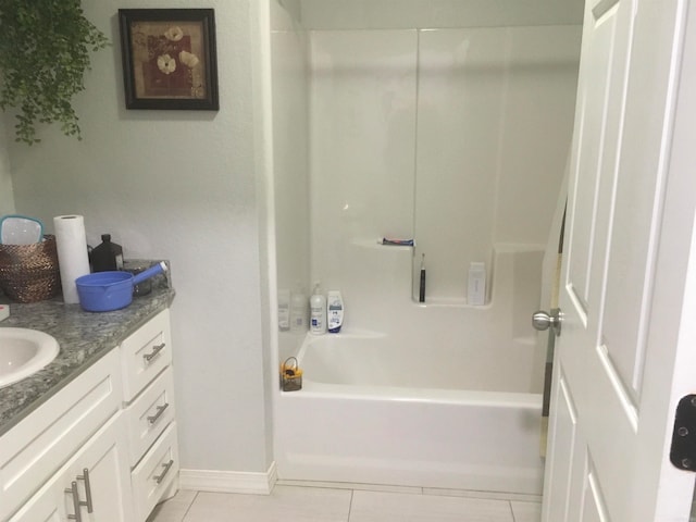 bathroom featuring vanity, shower with separate bathtub, and tile patterned floors