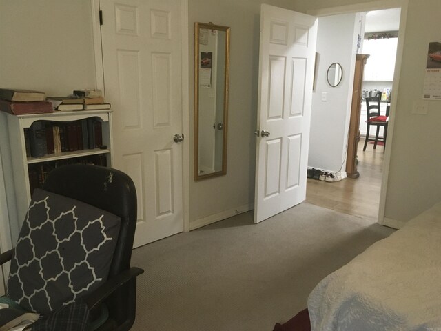 carpeted bedroom with baseboards