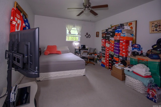 carpeted bedroom featuring a ceiling fan