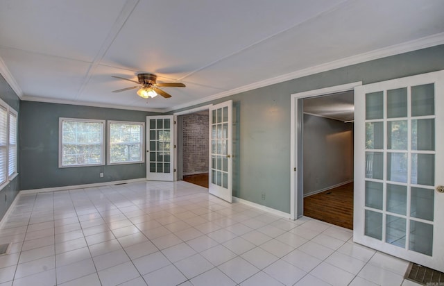 tiled empty room featuring french doors, crown molding, and ceiling fan