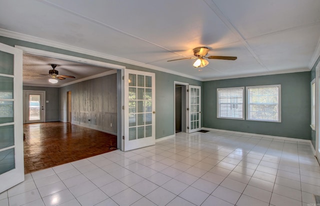 empty room featuring french doors, crown molding, light parquet floors, and ceiling fan