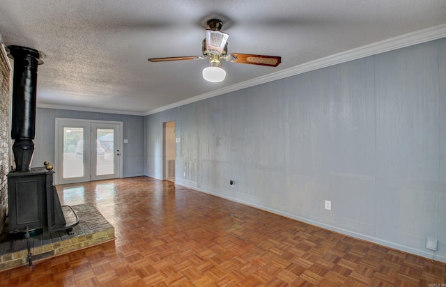 unfurnished living room featuring crown molding, parquet floors, a textured ceiling, and ceiling fan