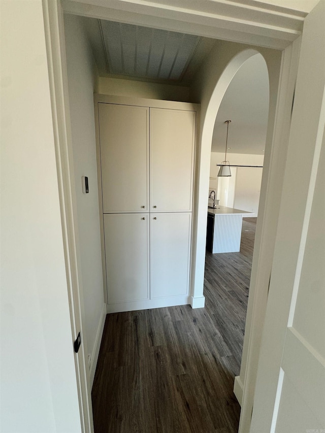 hall with dark hardwood / wood-style floors