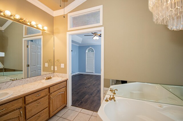 bathroom featuring tile patterned flooring, ornamental molding, vanity, a bath, and ceiling fan