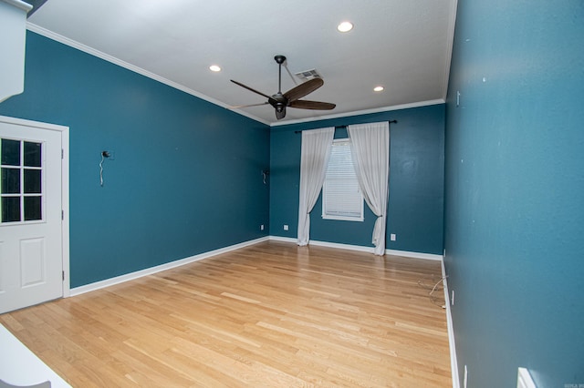 unfurnished room featuring light hardwood / wood-style flooring, ceiling fan, and crown molding