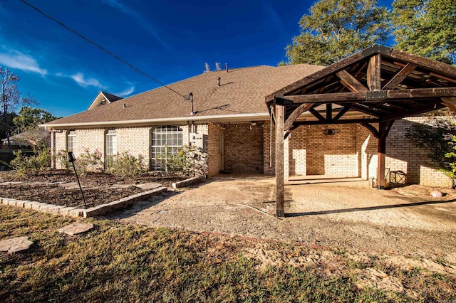 back of property with a patio