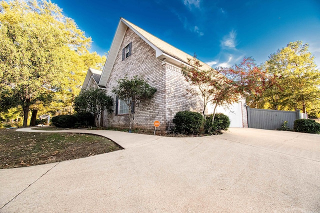 view of side of property featuring a garage