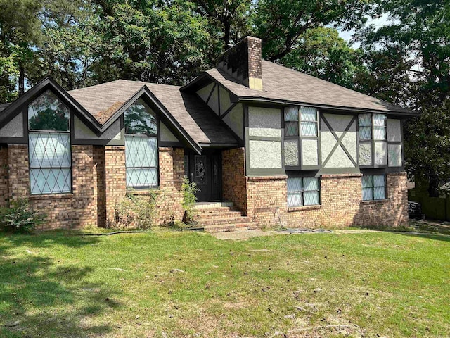 tudor home with a front yard