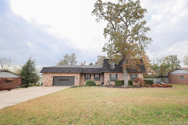 view of front of property with a garage and a front lawn