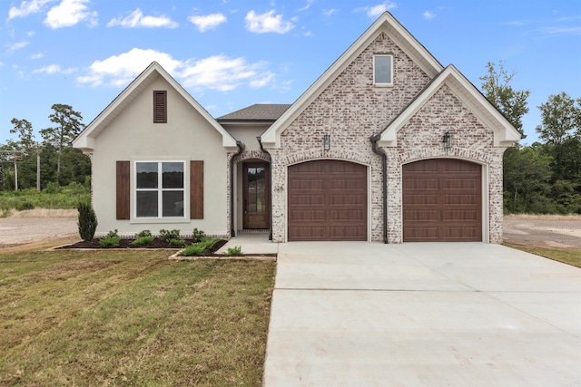 view of front facade with a front lawn and a garage