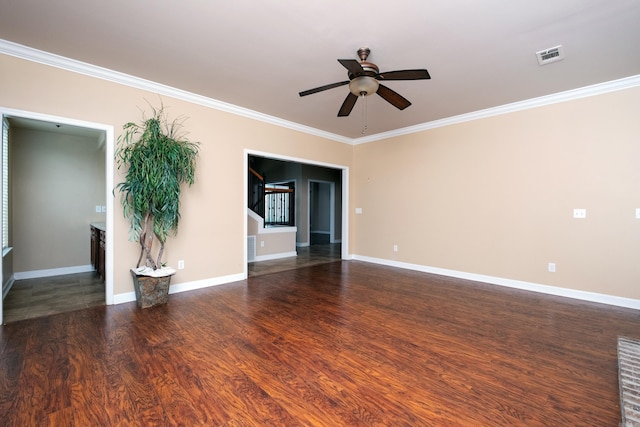 spare room featuring crown molding, ceiling fan, and dark hardwood / wood-style flooring