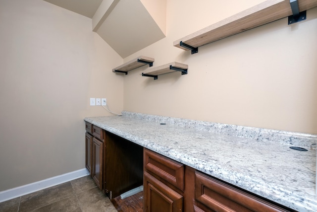 interior space with vanity and tile patterned floors