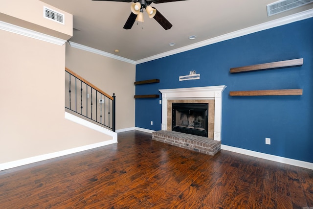 unfurnished living room featuring ceiling fan, ornamental molding, a fireplace, and hardwood / wood-style floors