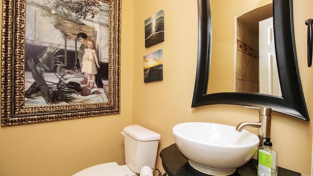 bathroom featuring toilet and sink