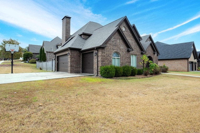 view of front of house with a front lawn and a garage