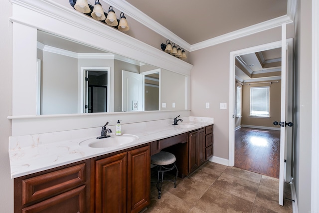 bathroom featuring vanity, crown molding, and hardwood / wood-style flooring