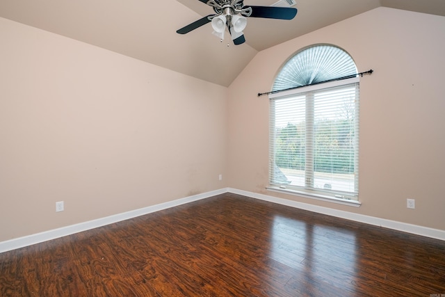 empty room featuring lofted ceiling, dark hardwood / wood-style floors, and ceiling fan