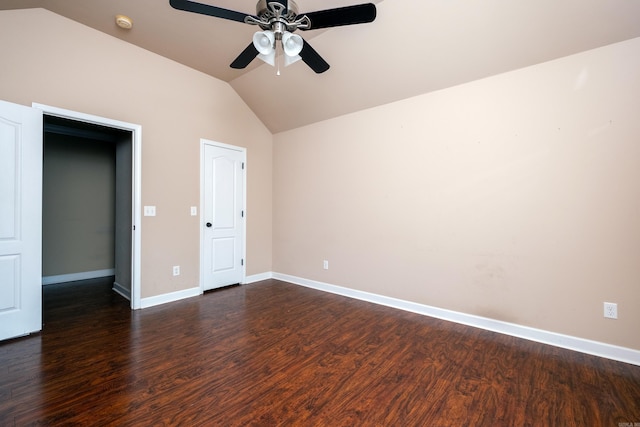 unfurnished bedroom featuring dark wood-type flooring, ceiling fan, and vaulted ceiling