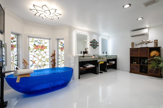 bathroom featuring vanity, a wall mounted AC, tile patterned flooring, and a bathing tub