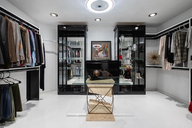 spacious closet with light tile patterned floors