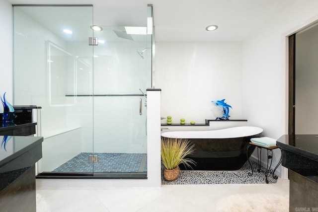 bathroom featuring vanity, separate shower and tub, and tile patterned floors