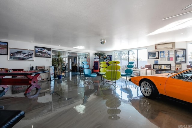 garage featuring a wall mounted AC