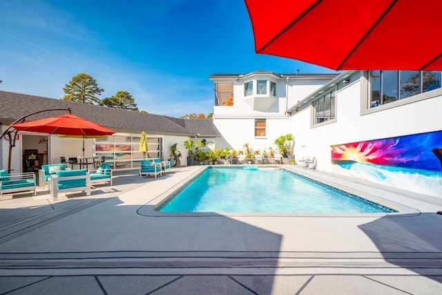 view of pool featuring a patio