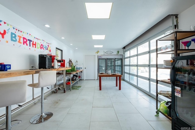 game room featuring light tile patterned floors